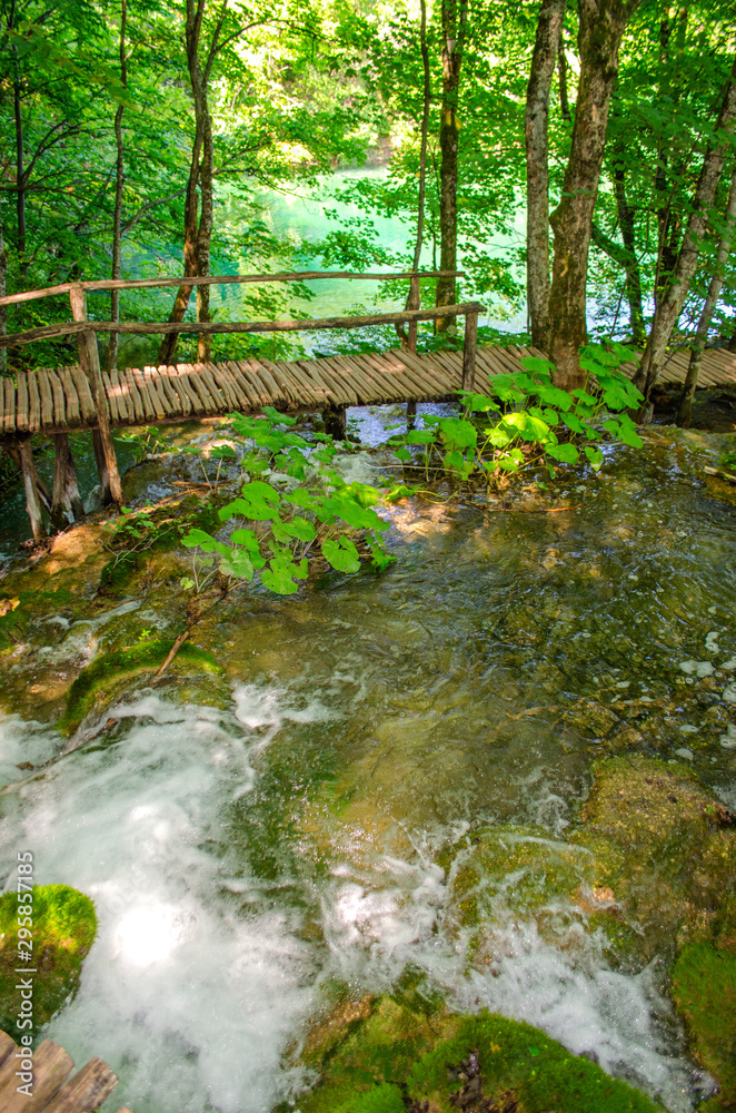 Picturesque landscapes of Plitvice Lakes with waterfalls, mountain rivers, forests and mountains