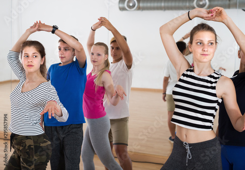 Boys and girls having dancing class in dance studio