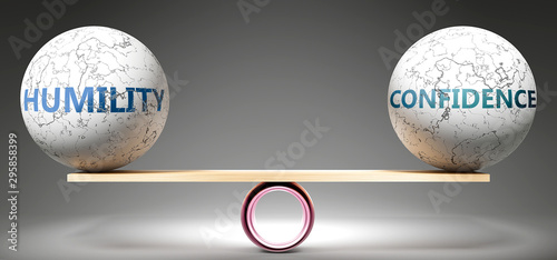 Humility and confidence in balance - pictured as balanced balls on scale that symbolize harmony and equity between Humility and confidence that is good and beneficial., 3d illustration photo