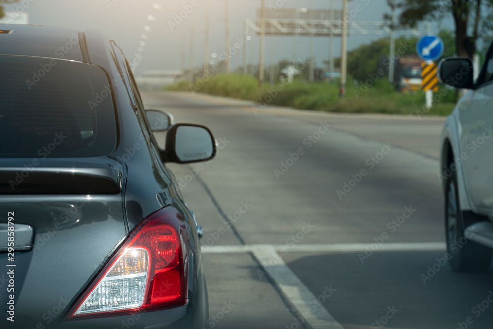 Luxury of gray car stop on the asphalt junction. Traveling in the provinces during the bright period. Luxury of gray car stop on the asphalt junction. Traveling in the provinces during the bright period.