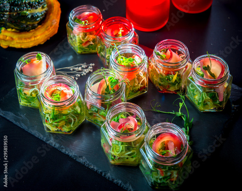 Salad of marinated seaweed with strips of marinated fillets of toothfish photo