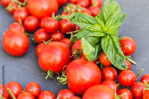 Fresh grape tomatoes with basil and garlic, pepper.