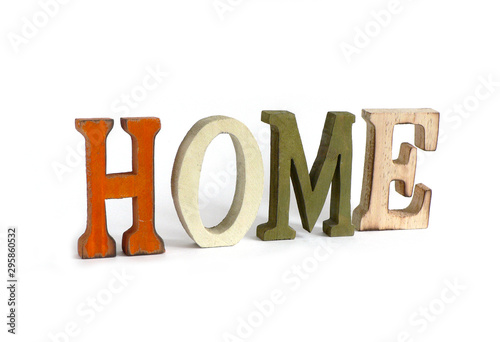 The inscription "HOME" of the wooden letters on a white background.