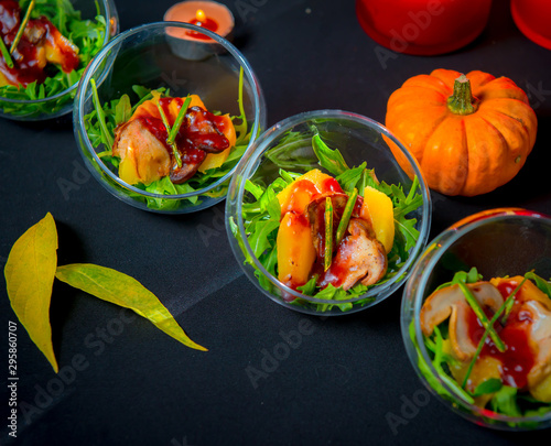 Baked pumpkin with arugula and porcini mushrooms with wild cranberry sauce