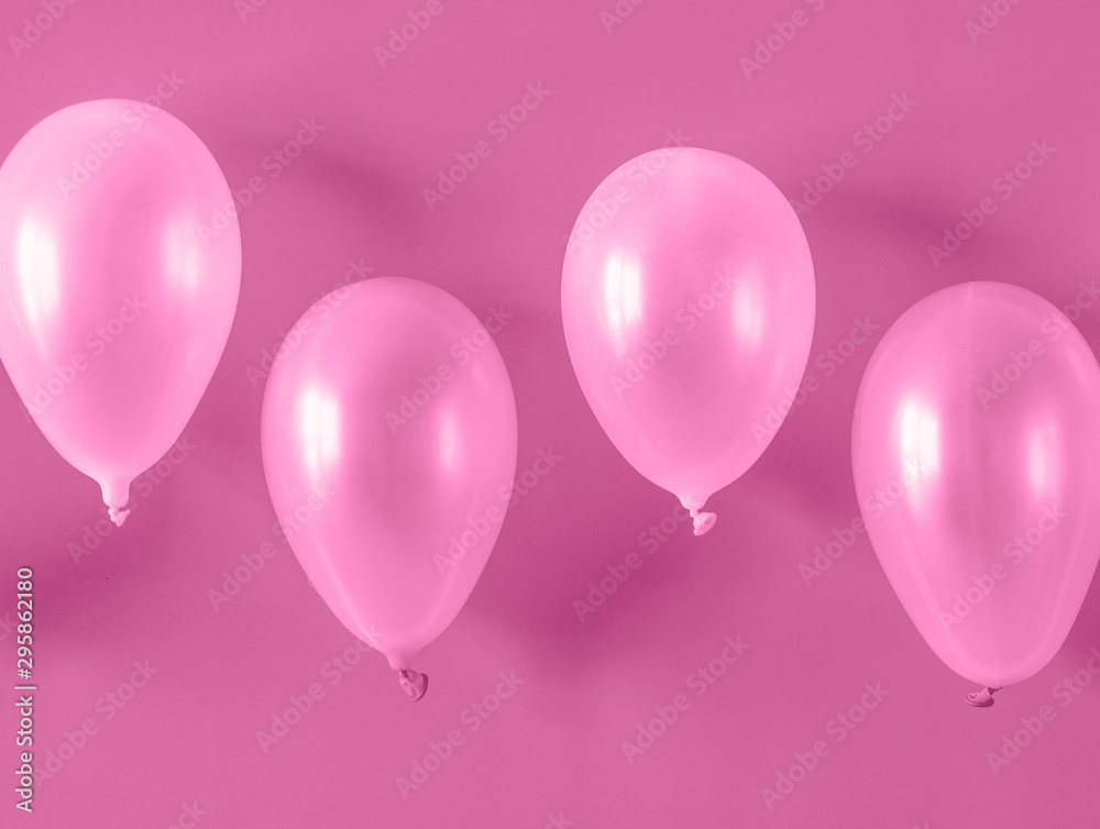 Pink balloons on pink background