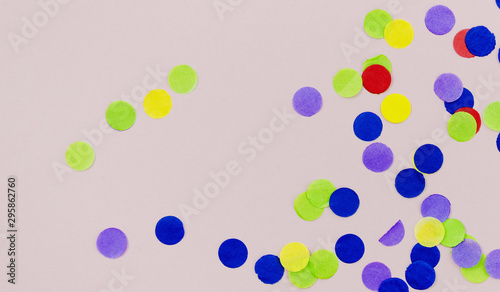 Colorful dots confetti on pink background