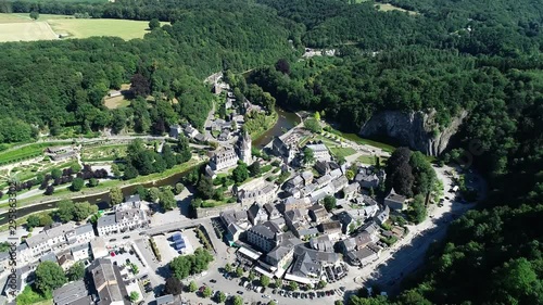 Aerial 4K footage, over the valley, where Durbuy Castle is located. Belgium, province of Luxembourg in the Wallonia region. Beautiful landscape with river, sunny weather during summer season. photo