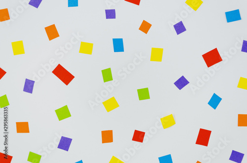 Squared colorful confetti on blue background