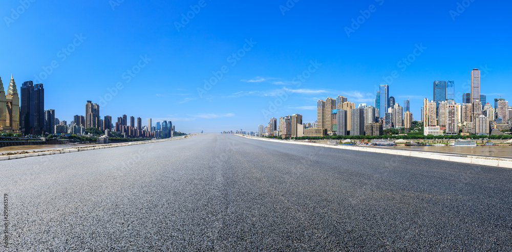 Empty asphalt highway and modern city financial district in chongqing,China. Empty asphalt highway and modern city financial district in chongqing,China.