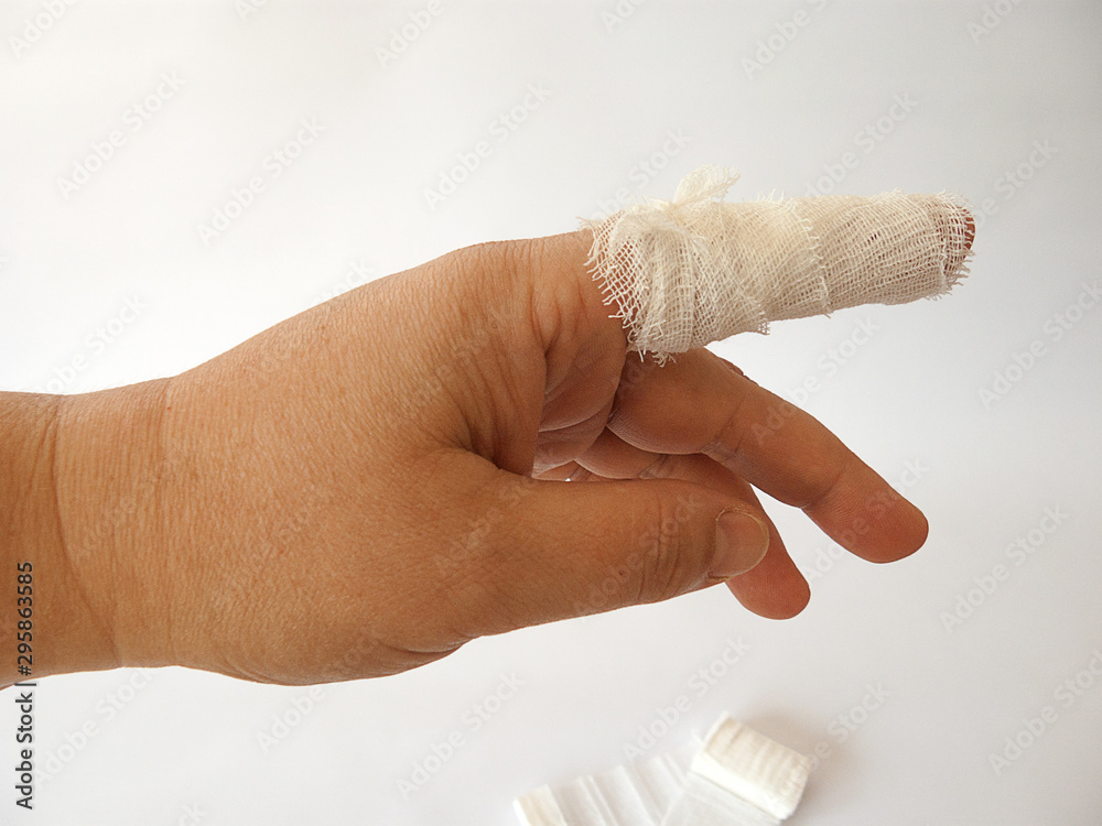 cut index finger. processed with a bandage. Photos | Adobe Stock