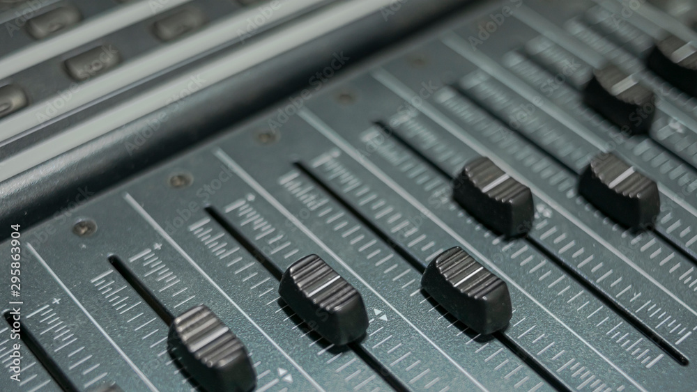 Close-up of faders of a professional sound mixer
