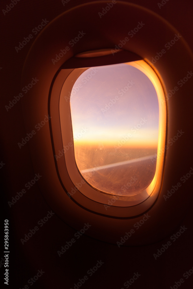 plane window ,beautiful sunset on the plane warm tone sunset plane window ,beautiful sunset on the plane warm tone sunset