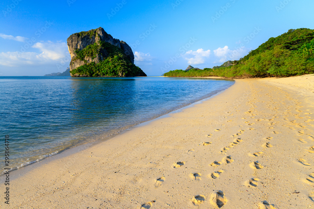 Woman walking on tropical beach