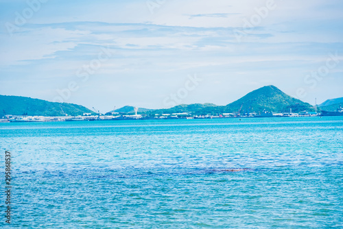seascape view with boat and mountain view in sunny day.
