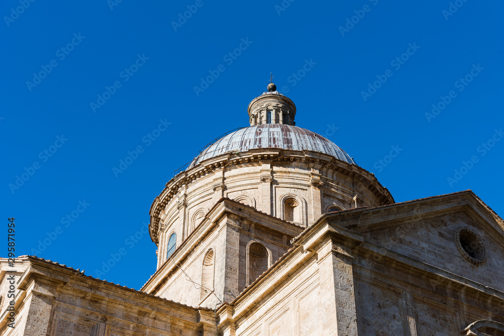 The dome of Chiesa di San Biagio, a small Renaissance church in it Montepulciano against the blue sky, Tuscany, Italy.