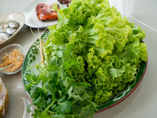 Lettuce and coriander is healthy for body,Ingredient Thai food name is Maing PLA-too or salad fried fish,Street food in Bangkok photo