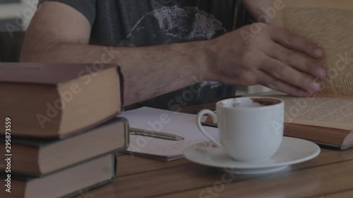 Man reading book on the table