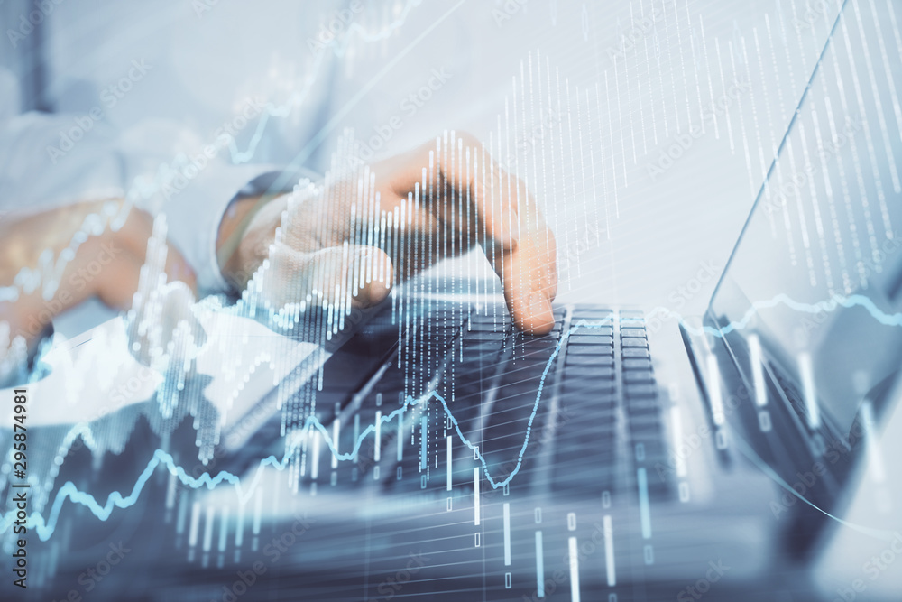Double exposure of market chart with man working on computer on background. Concept of financial analysis. Double exposure of market chart with man working on computer on background. Concept of financial analysis.