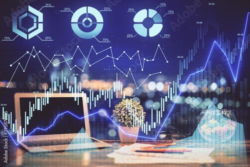 Forex graph hologram on table with computer background. Double exposure. Concept of financial markets.