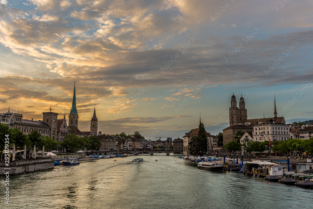 Zurich downtown skyline with Fraumunster and Grossmunster churches at lake zurich during beautiful sunset, Switzerland