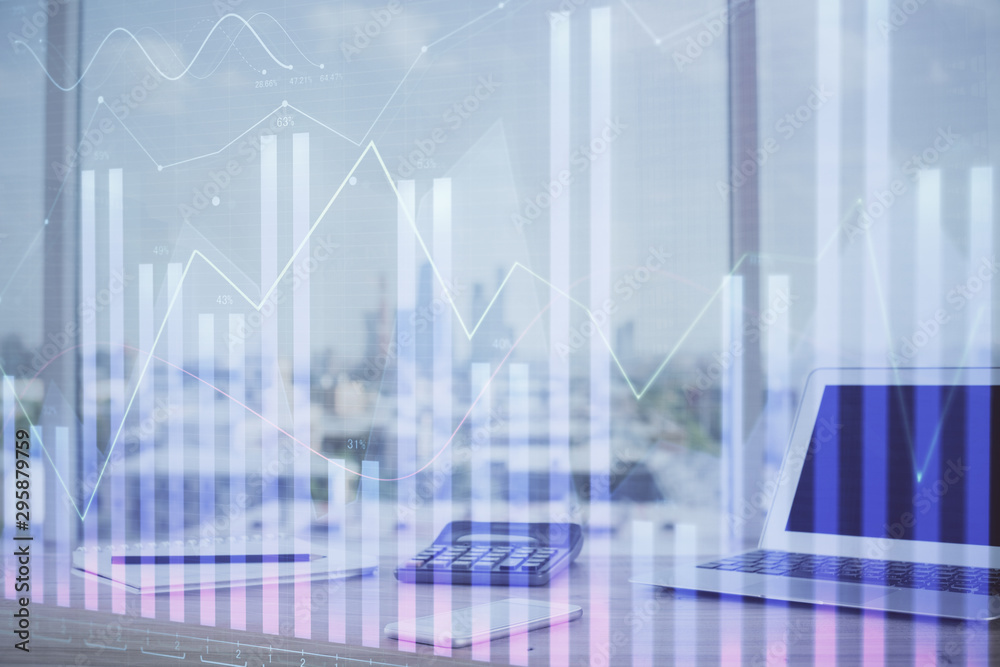 Forex graph hologram on table with computer background. Multi exposure. Concept of financial markets. Forex graph hologram on table with computer background. Multi exposure. Concept of financial markets.