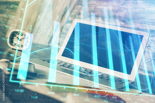 Forex Chart hologram on table with computer background. Double exposure. Concept of financial markets.