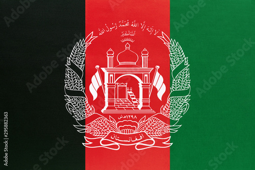 Afghanistan national fabric flag, textile background. Symbol of international asian world country.