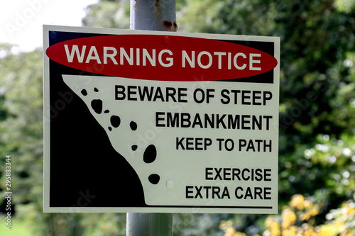 Bild auf Leinwand Steep Embankment Warning Sign on a Country Path