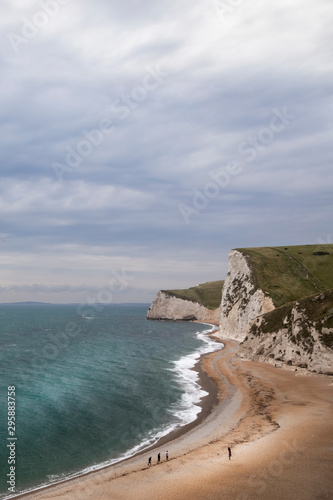 views of rock formations and beach at durdle dor