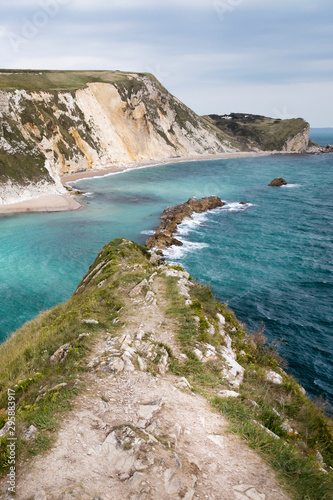 views of rock formations and beach at durdle dor