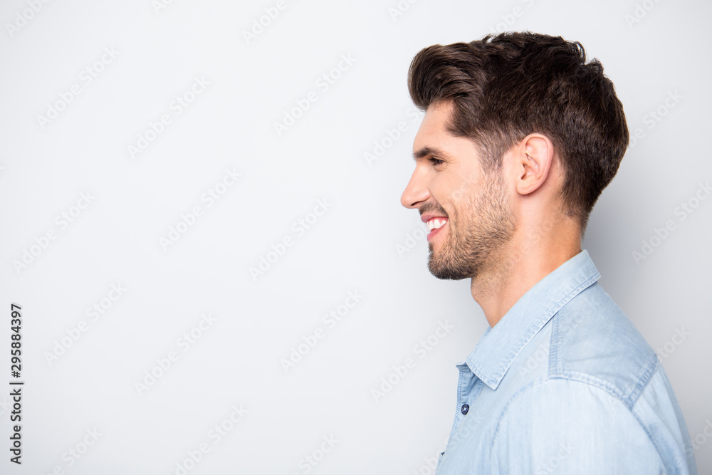 Profile side photo of charming satisfied positive man enjoy weekends have fun with his friends family wear denim jeans casual style clothes isolated over grey color background Profile side photo of charming satisfied positive man enjoy weekends have fun with his friends family wear denim jeans casual style clothes isolated over grey color background