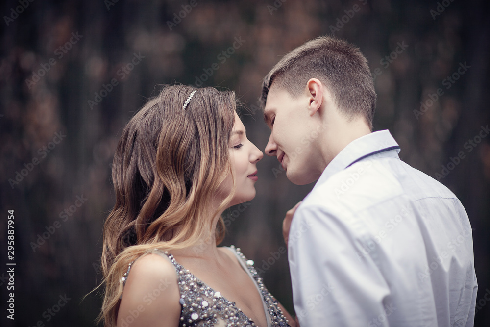 Two lovers in the forest. Photoshoot in the rainy forest