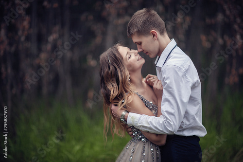 Two lovers in the forest. Photoshoot in the rainy forest