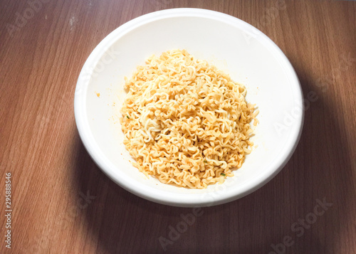 Noodles in a wooden table top cup