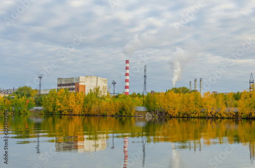 Pipes metallurgical plant at the lake.