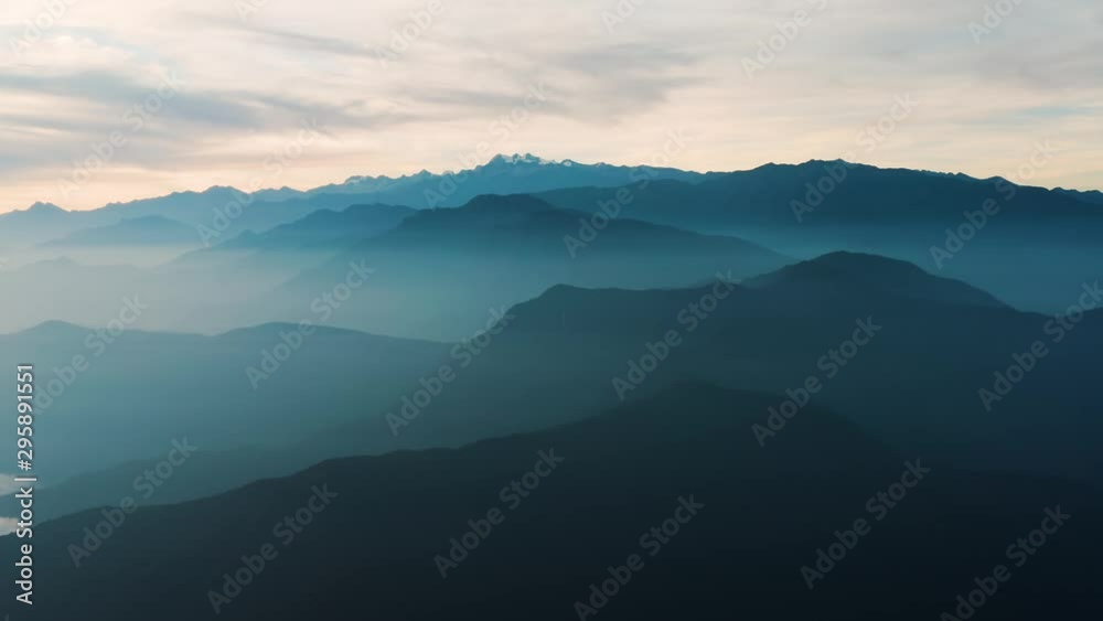 Mountains in the misty morning, Pico Cristobal Colon, Pico Simon Bolivar in the distance, Highest peaks of Colombia, drone aerail timelapse