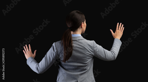 Businesswoman Using Virtual Touchpad Standing Over Black Background, Panorama