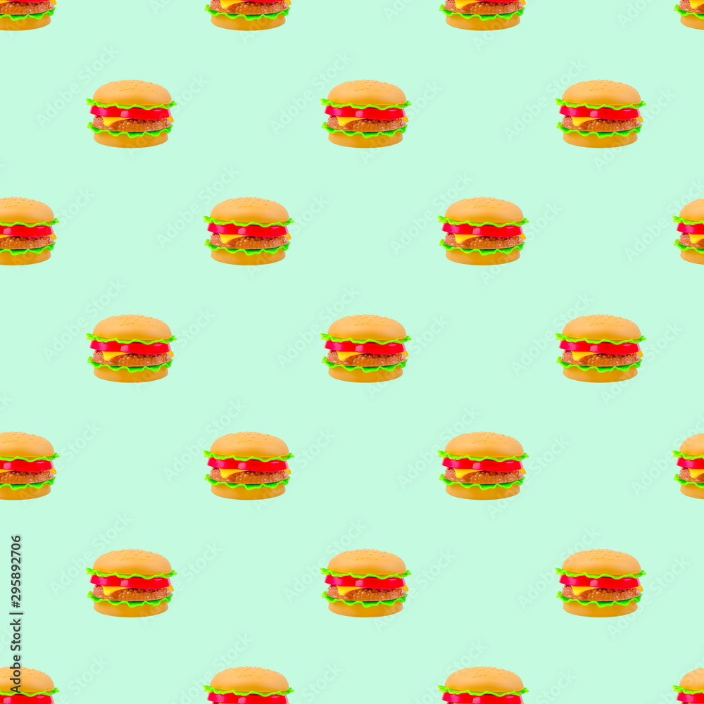 fast food pattern plastic burger on a blue mint background