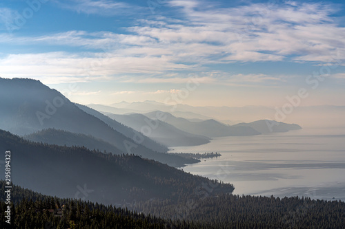 East shore of Lake Tahoe in California and in Nevada near Reno, in early Autumn with smoke from nearby wildfires coming over the mountains.