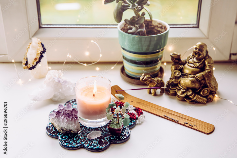 Stockfoto Asian money tree Crassula Ovata growing on window sill in home  Feng Shui wealth and prosperity invitation altar. With smoking incense  stick, laughing Buddha and crystal clusters. | Adobe Stock
