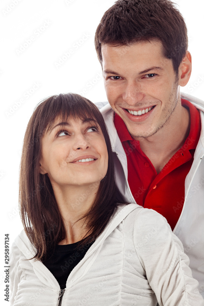 Young couple posing against white background Young couple posing against white background