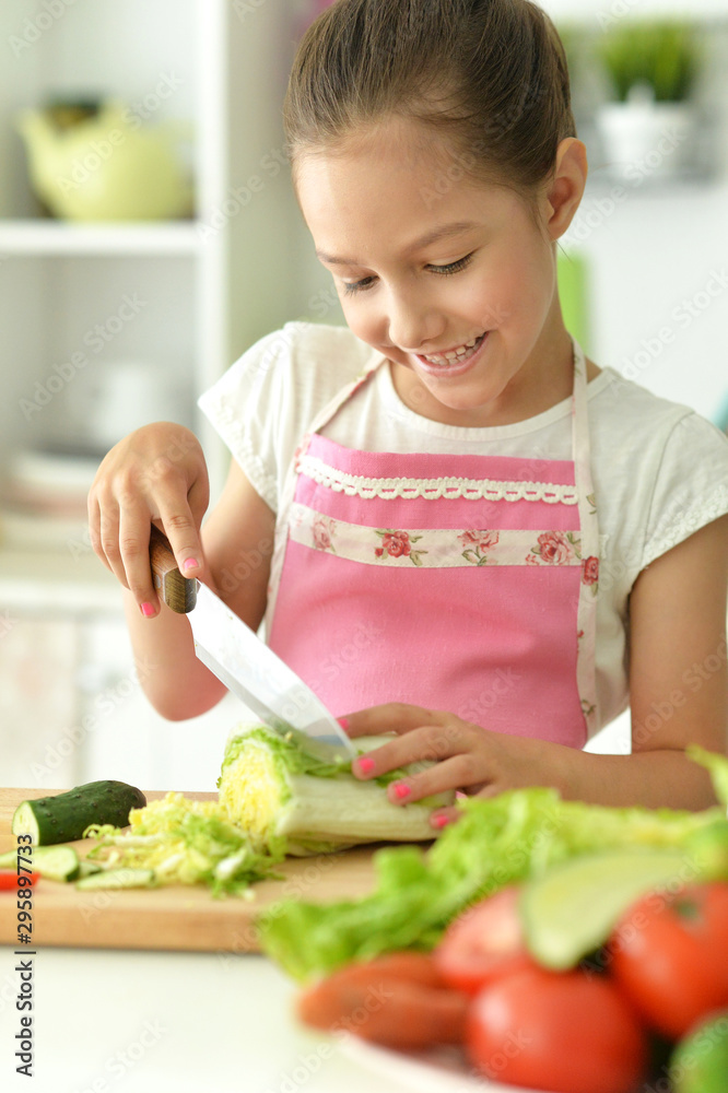 Close up portrait of cute girl preparing delicious fresh salad in kitchen Close up portrait of cute girl preparing delicious fresh salad in kitchen
