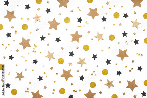 Christmas gold and black decoration, stars, snowflakes on white background, flat lay, top view