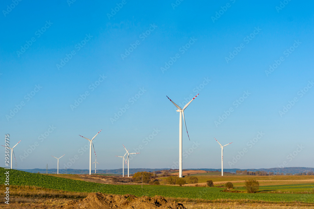 Wind turbines generating electricity. Electrical windmills. Wind turbines generating electricity. Electrical windmills.