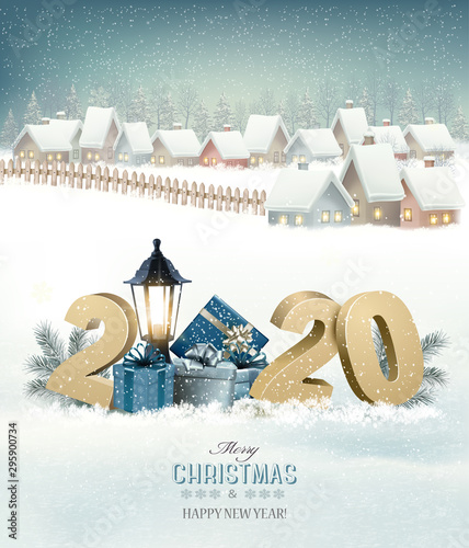 Winter christmas holiday background with a snowy village landscape and 2020. Vector.