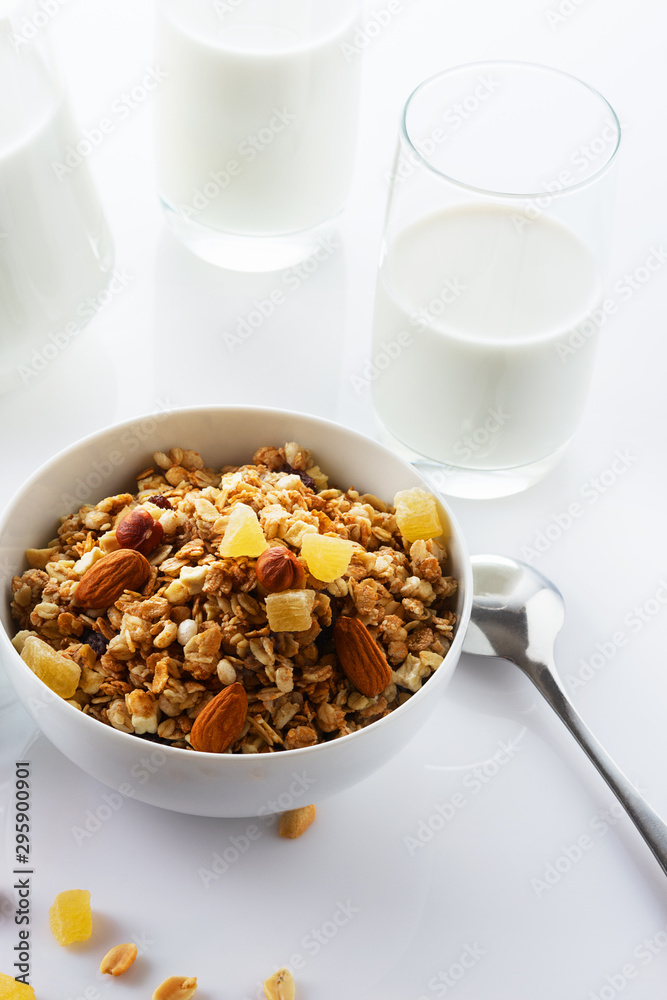 Health food. Muesli with milk and the baked apple. High key. Close up. Selective focus.