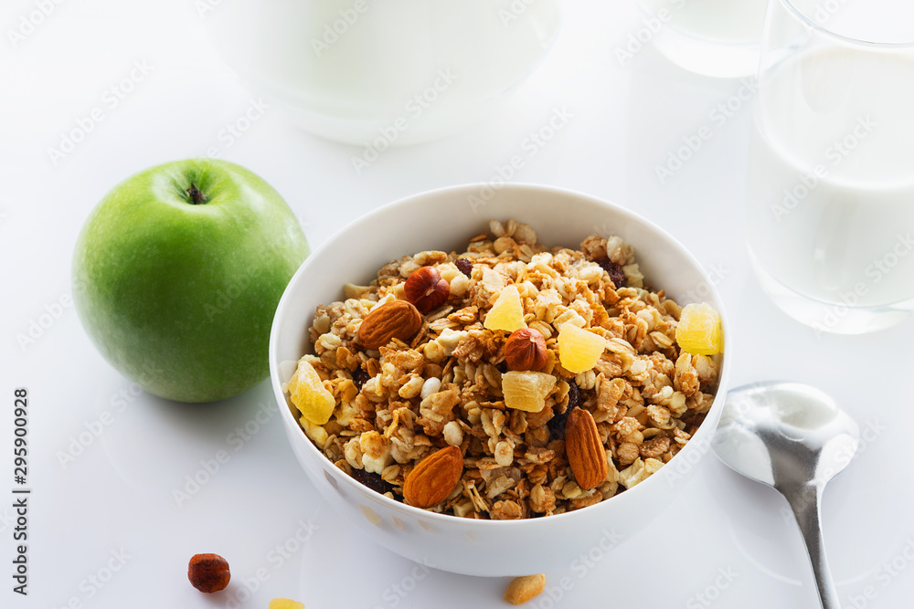 Health food. Muesli with milk and the baked apple. High key. Close up. Selective focus.