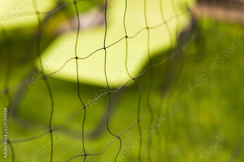 Abstract badminton net pattern with green background