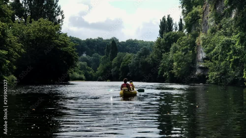 Summer vacation fun kayaking down the River Dordogne in France with the family Summer vacation fun kayaking down the River Dordogne in France with the family