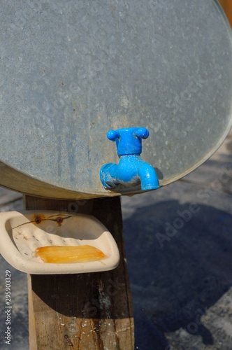 фотографія tin washstand and bar of soap